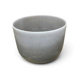 Rare Earth Gallery 10-inch obsidian gem-infused quartz singing bowl tuned to note F at 440 Hz for sound healing.