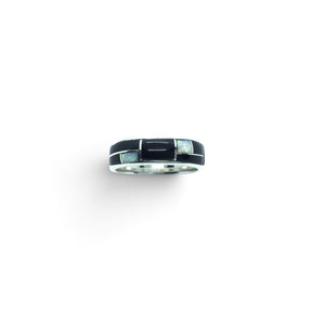 Rare Earth Gallery ring featuring black onyx and white opal inlay with silver channeling in a geometric design.
