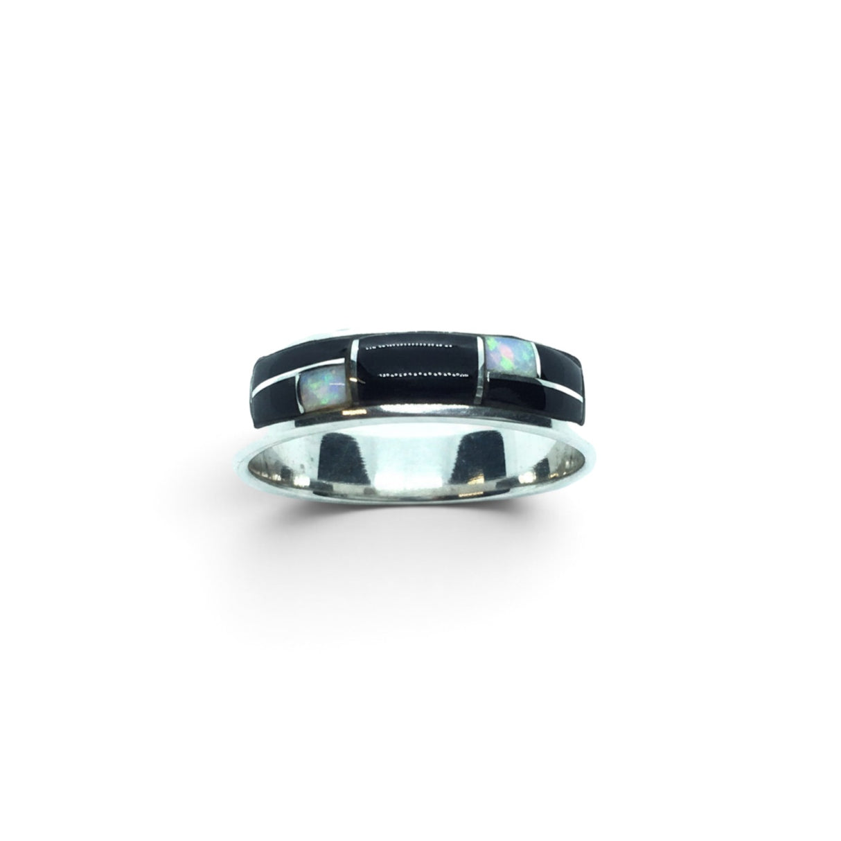 Rare Earth Gallery ring featuring black onyx and white opal inlay with silver channel detailing on a polished band.