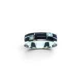 Rare Earth Gallery ring featuring black onyx and white opal inlay with silver channel detailing on a polished band.