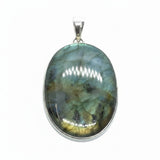 Rare Earth Gallery oval labradorite pendant with teal and yellow flashes and black accents in a silver setting.