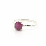 Rare Earth Gallery faceted ruby stalactite ring in a silver prong setting, size 11, isolated on a white background.