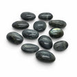 Rare Earth Gallery extra small tumbled labradorite palm stones with blue and gold iridescent flash on white background