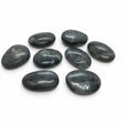 Rare Earth Gallery extra-small tumbled labradorite palm stones with subtle blue and green iridescent flashes.