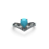 Rare Earth Gallery turquoise pear cabochon ring with white CZ chevron accents on a 925 sterling silver band