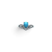 Rare Earth Gallery pear-shaped turquoise cabochon ring with white CZ chevron accents on a 925 sterling silver band.