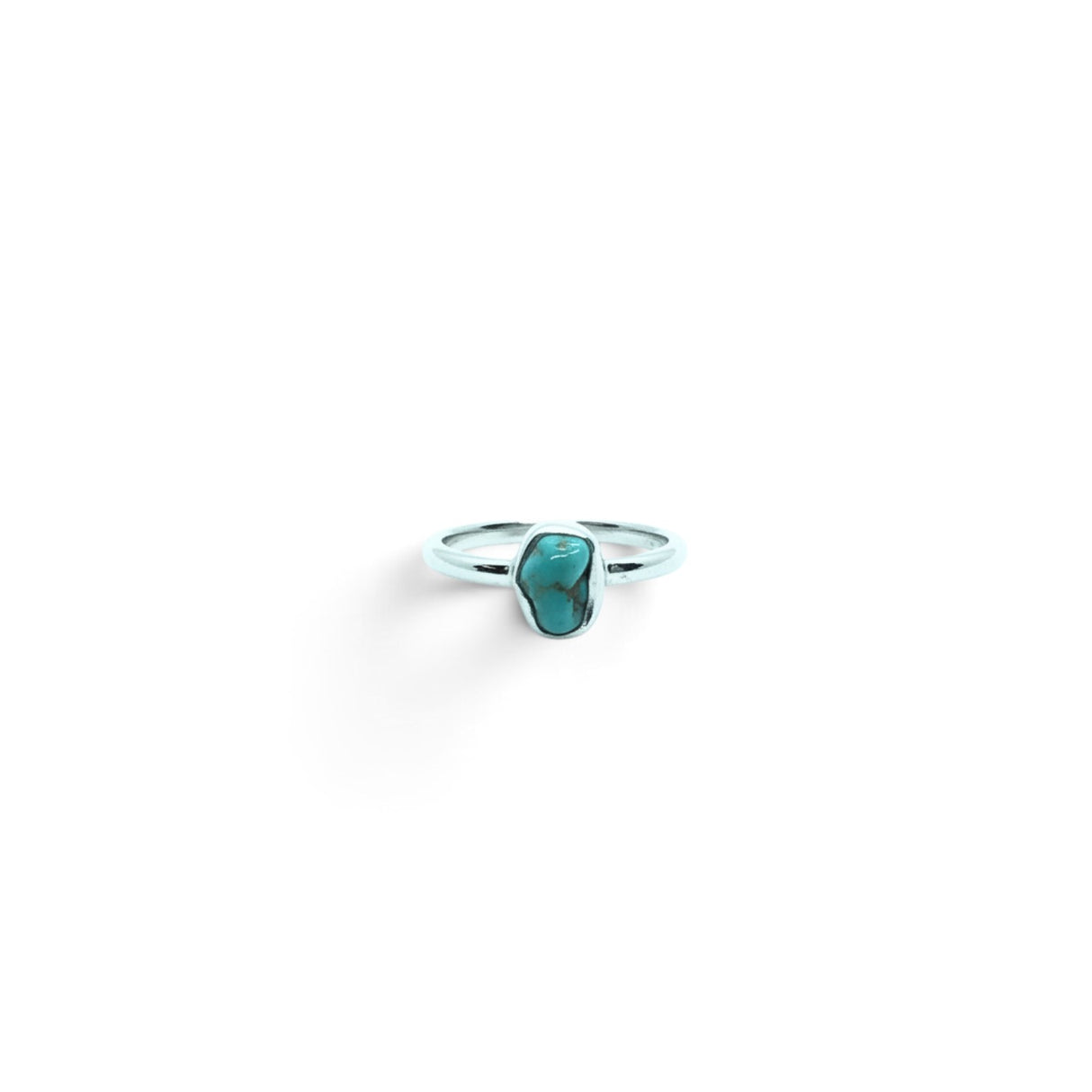 Rare Earth Gallery turquoise nugget ring in a simple silver bezel setting, size 4, isolated on white background.
