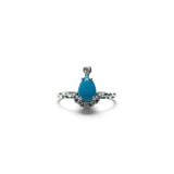Rare Earth Gallery pear-shaped turquoise cabochon ring with white CZ accents on a textured 925 sterling silver band.