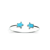 Rare Earth Gallery turquoise turtle twist bracelet featuring two sea turtle charms with polished silver bezels