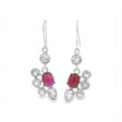 A pair of silver drop earrings featuring oval pinkish-red cabochon gemstones surrounded by clear round and teardrop-cut stones, shown against a plain white background.