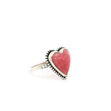 Thulite heart cabochon ring bezel set in a beaded sterling silver frame, angled view